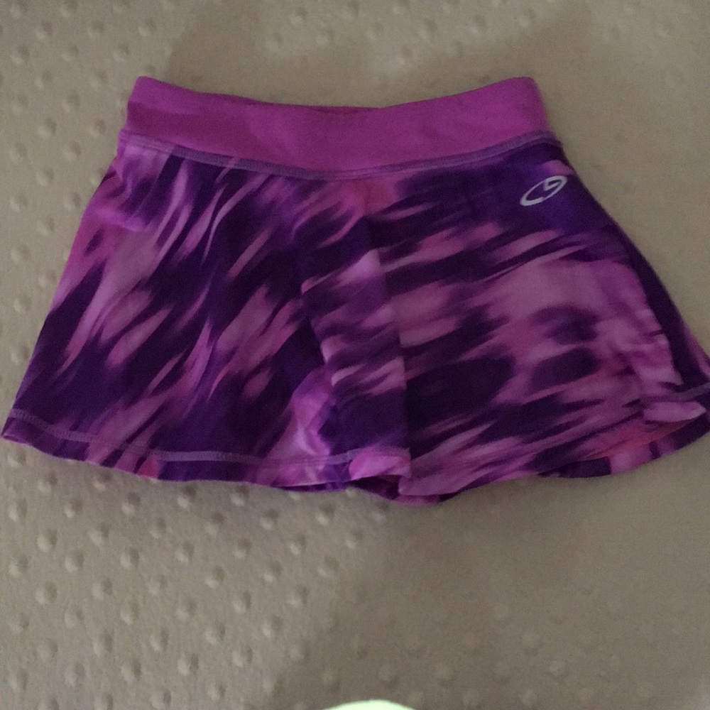 Cute Champion girls purple and pink swirl skirt.